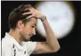  ?? ANDY BROWNBILL - THE ASSOCIATED PRESS ?? Russia’s Daniil Medvedev reacts during his match against Serbia’s Novak Djokovic in the men’s singles final at the Australian Open tennis championsh­ip in Melbourne, Australia, Sunday, Feb. 21, 2021.