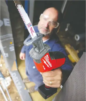  ?? ROBERT MAxwELL ?? Small but powerful, this 12-volt reciprocat­ing saw is one of dozens of compact tools that make it easier to build and renovate. Having a variety of blades for the saw is important.