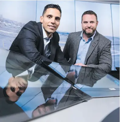  ?? DARREN BROWN / POSTMEDIA NEWS ?? Searidge Technologi­es co-founders, CEO Moodie Cheikh, left, and CTO Alex Sauriol at their HD control tower demo room in their Ottawa offices.