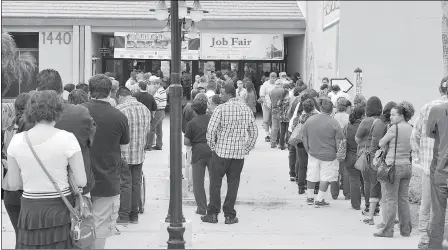  ?? Buy this photo at YumaSun.com FILE PHOTO BY RANDY HOEFT/YUMA SUN ?? PEOPLE STAND IN THREE LINES OUTSIDE YUMA CIVIC CENTER for a past Community Job and Education Fair.