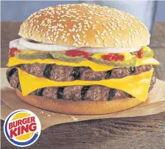  ??  ?? This photo provided by Burger King shows the fast-food chain’s new Double Quarter Pound King burger.