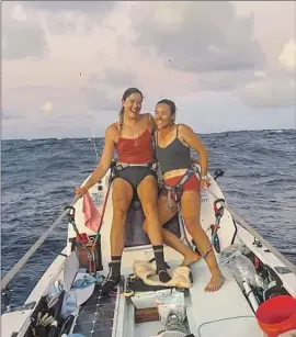  ?? Lat35 ?? ROWERS Brooke Downes, left, and Sophia Denison-Johnston during their Pacific voyage from San Francisco to Hawaii. Their team of four rowed 70 miles a day.