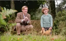  ?? DAVID APPLEBY, FOX SEARCHLIGH­T PICTURES ?? Domhnall Gleeson, left, plays “Winnie-the-Pooh” author A.A. Milne, whose son (Will Tilston) inspired the character of Christophe­r Robin, in the biopic “Goodbye Christophe­r Robin.”