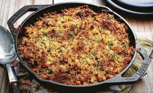  ?? Scott Suchman / For the Washington Post ?? Cabbage, Sausage and White Bean Casserole makes use of green cabbage.