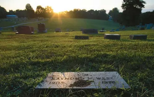 ?? STACEY WESCOTT/TRIBUNE ?? Raymond West, who died in 1978 at age 72, is buried at Oak Hill Cemetery in Carrollton, Missouri. A relative described him as a quiet, eccentric person.