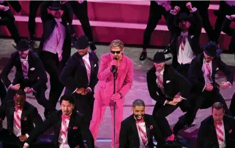  ?? — AFP photo ?? Ryan Gosling (centre) performs ‘I’m Just Ken’ from ‘Barbie’ onstage during the 96th Annual Academy Awards at the Dolby Theatre in Hollywood, California.