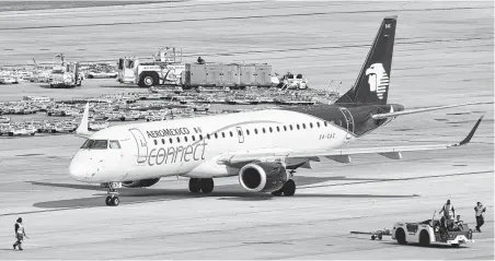  ?? Bill Montgomery / Houston Chronicle file ?? An AeroMexico Connect Embraer 190 leaves its gate at IAH. Boeing is taking over Embraer’s commercial jet business.