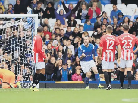  ??  ?? Shayne Ward celebrates scoring from the penalty spot .