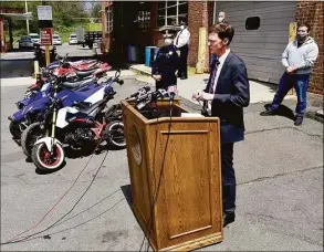  ?? Hearst Connecticu­t Media file photo ?? New Haven Mayor Justin Elicker, second from right, addresses the media during a press conference announcing ATV and dirt bike enforcemen­t and arrests of riders in May 2020.