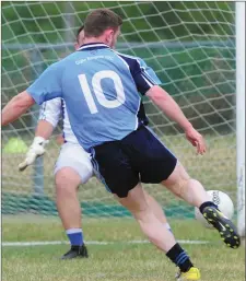  ??  ?? Niall Sharkey finds the net for Glyde Rangers.