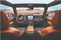  ??  ?? The 2021 Ford Bronco’s high-tech features include a Sync 4 infotainme­nt system, off-road navigation and cameras in front of the wheels.