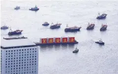  ?? CALVIN NG / CHINA DAILY ?? Boats sail across the Victoria Harbour with national flags fluttering on them, celebratin­g the 23rd anniversar­y of the city return to the motherland and the promulgati­on of the national security law for Hong Kong.