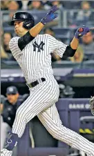  ?? Getty Images; N.Y. Post: Charles Wenzelberg ?? VALUE PICKS: While the Yankees didn’t go big in the first-base or shortstop markets, they are getting value from Anthony Rizzo (left) and Isiah Kiner-Falefa.