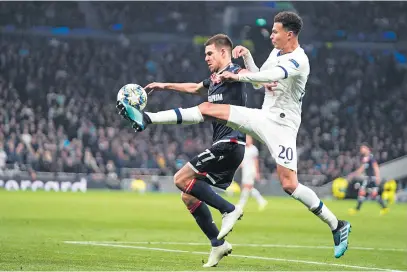  ?? Picture: EPA-EFE ?? IN BATTLE. Red Star’s Marko Gobeljic (L) and Tottenham’s Dele Alli in action during the Uefa Champions League group B match at the Tottenham Hotspur Stadium in London last night.