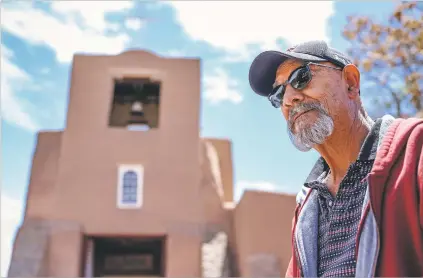  ??  ?? Pete Aguilar, a local electricia­n, is outside the San Miguel Mission following a brief inspection earlier this month. Aguilar has worked on various jobs for the chapel, which dates to the 1600s.