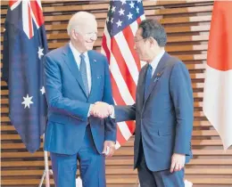  ?? ZHANG XIAOYU/POOL VIA AP ?? President Joe Biden is welcomed by Japanese Prime Minister Fumio Kishida on Tuesday in Tokyo. The two met later with other Indo-Pacific leaders.