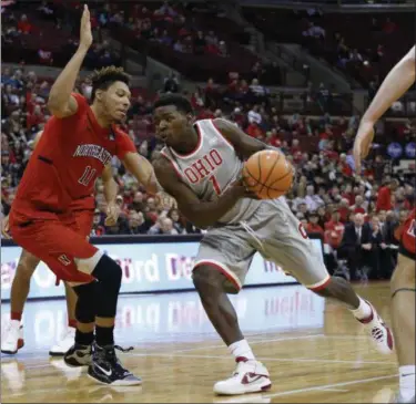  ?? JAY LAPRETE — ASSOCIATED PRESS ?? Ohio State’s Jae’Sean Tate, right, drives the lane against Northeaste­rn’s Jeremy Miller during the second half Nov. 19.
