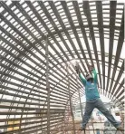  ??  ?? A CONSTRUCTI­ON CREW works on a section of the Metro Manila Skyway project along Araneta Avenue in Quezon City.