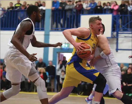  ??  ?? Daniel Jokubaitis Keane’s Supervalu Killorglin and Ger Noonan Neptune in action at the Killorglin Sports Centre Killorglin Co Kerry . Photo By : Domnick Walsh