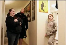  ?? SARA CLINE — THE ASSOCIATED PRESS FILE ?? Taylor Wood and her boyfriend, Ryan Bowser, talk to Wood’s 10-year-old daughter, Freya Wood, in Corvallis, Ore. The family, which has been living in the apartment for more than two years, has missed three rent payments during the pandemic.