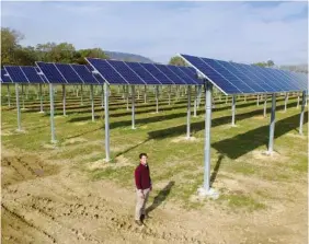  ?? STAFF PHOTO BY TIM BARBER ?? Trey Danks, 21, the son of founder Barney Danks, helped build the Rossville Solar Farm that will go online next week in Rossville.