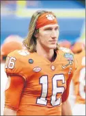  ?? CHRIS GRAYTHEN/TNS ?? Quarterbac­k Trevor Lawrence is headed to the NFL after going 34-2 at Clemson.