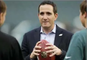  ?? FILE ?? Expect Howie Roseman, the Eagles vice president of football operations, to be a busy man when the 2018 NFL Draft starts Thursday. The reigning Super Bowl champions have the No. 32 pick in the first round, but no selections in the second and third...