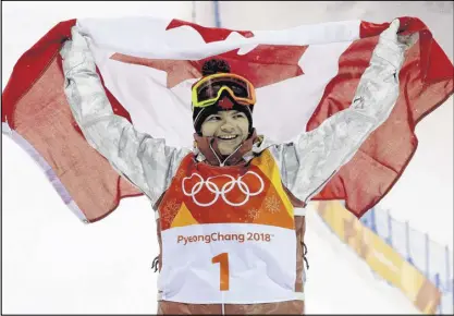  ?? AP PHOTO/KIN CHEUNG ?? Gold medal winner Mikaelâ Kingsbury, of Canada, celebrates after the men’s moguls qualifying at Phoenix Snow Park at the 2018 Winter Olympics in Pyeongchan­g, South Korea, Monday.