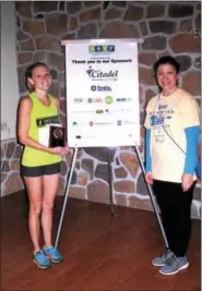  ?? SUBMITTED PHOTO ?? RSVP’s Run Wild 5K Female Overall winner Whitney Belmonte of North Wales, seen here with Michele Moll, RSVP Executive Director, clocked a time of 20:42.