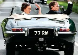  ??  ?? Old wave: Pippa and James drive off in the classic E-Type
