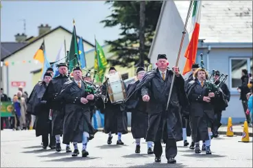  ?? ?? The Liam Lynch Memorial Pipe Band from Anglesboro­ugh proudly marching in Newcastle as part of the centenary celebratio­ns over the Easter wekeend.