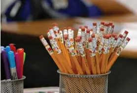  ?? Davie Hinshaw/The Charlotte Observer via AP ?? ■ Pencils are at the ready on a teacher’s desk July 24, 2017, at Bruns Academy in Charlotte, N.C. The Educator Expense Deduction is a $250 tax deduction to help recoup out-of-pocket costs for outfitting a classroom, getting training or buying teaching materials.