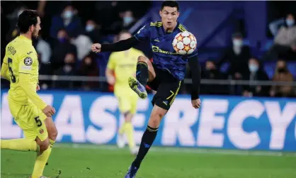  ?? Photograph: Soccrates Images/Getty Images ?? Cristiano Ronaldo’s lob puts Manchester United in front late on at Villarreal.