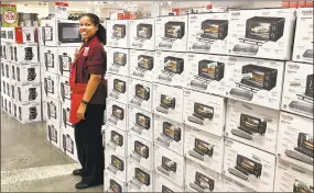  ?? Chris Bosak / Hearst Connecticu­t Media file ?? Lisa-Marie Irizarry, general manager of the JCPenney at Danbury Fair, stands among the Black Friday displays of small appliances at the store last November.