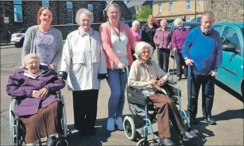  ??  ?? Staff, volunteers and clients enjoying a walk.