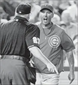  ?? | RICHARD LIPSKI~AP ?? Cubs manager Dale Sveum confronts home-plate umpire Larry Vanover in the fifth inning Wednesday after being ejected.