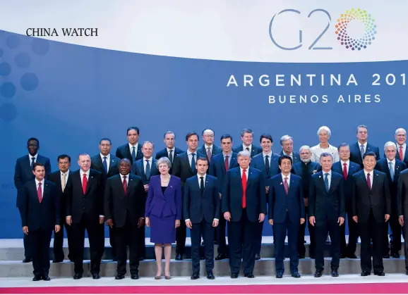  ??  ?? The 13th G20 summit convenes in Buenos Aires, Argentina, on November 30, 2018. President Xi Jinping attends the first phase of the meeting and delivers an important address. The picture shows Xi Jinping and other state leaders posing for a group photo at the meeting.