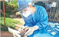  ??  ?? Wang Qian, deputy chief physician of the Department of Neonatolog­y, Hunan Provincial Maternal and Child Health Care Hospital, China medical team member tests a local employee