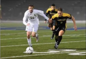  ?? AUSTIN HERTZOG — DIGITAL FIRST MEDIA ?? Spring-Ford’s Brett Gulati carries the ball as Freedom’s Wesley Young defends.thinks about Spring-Ford soccer.”