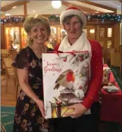  ??  ?? Courtown Golf Club lady Captain Julie with the winner of the Christmas Fare, Mary Cooper.