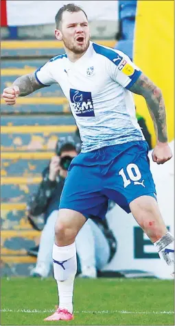  ??  ?? PUNCH POWER: James Norwood celebrates scoring Tranmere’s third