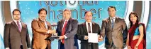  ?? ?? Lanka SSL CEO and Director Pravin De Silva (second from left) receiving the award. Also seen here is Gayan Pathinayak­a, Lalinda Geekiyanag­e, and Anusha Weerasingh­e.