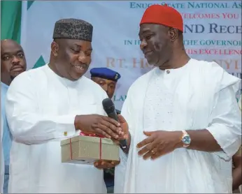  ??  ?? Gov. Ugwuanyi receiving a gift from Senator Ekweremadu when the Enugu State National Assembly Caucus hosted the former at a reception in Abuja