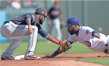  ?? RICK SCUTERI, USA TODAY SPORTS ?? Cubs right fielder Jason Heyward, right, struggled at the plate last season, batting .230 with a career-low seven home runs.