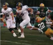  ?? RANDY MEYERS — THE MORNING JOURNAL ?? Luke Lombardo of Olmsted Falls runs by Hunter Parker of Amherst for a big gain during the first quarter Sept. 29.
