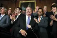  ?? JACQUELYN MARTIN — THE ASSOCIATED PRESS ?? House Ways and Means Chair Rep. Kevin Brady, R-Texas, center, is welcomed by House Republican­s including from left, House Majority Leader Kevin McCarthy of Calif., House Speaker Paul Ryan of Wis., Rep. Carlos Curbelo, R-Fla., and Rep. Cathy McMorris...