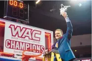  ?? NEW MEXICO STATE PHOTO ?? New Mexico State men’s basketball coach Chris Jans celebrates his team’s 2018 WAC title. The team had been practicing without state permission.