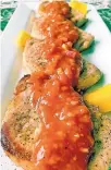  ?? KAREN KANE/TNS ?? Spicy mango barbecue sauce is a tasty go-to with any roasted meat or fish, such as these pork chops.