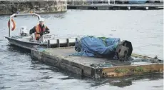  ??  ?? 0 The statue of slave trader Edward Colston is retrieved from Bristol Harbour after it was thrown in by Black Lives Matter protesters at the weekend. Right, Scouts next to a statue of Robert Baden-powell on Poole Quay in Dorset ahead of its expected removal to safe storage