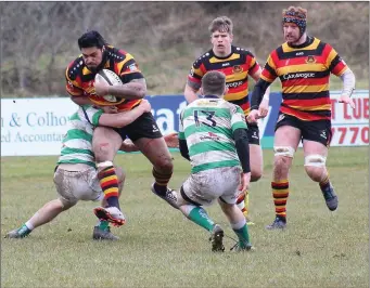  ??  ?? Sligo RFC’S Mata Fifita powers through with the ball.